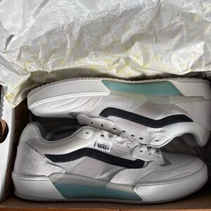 Vans White Low-Top Sneakers with Black Wave and Teal Heel Accent